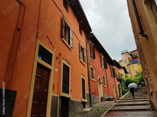 Verona's narrow pedestrian street with brightly colored houses