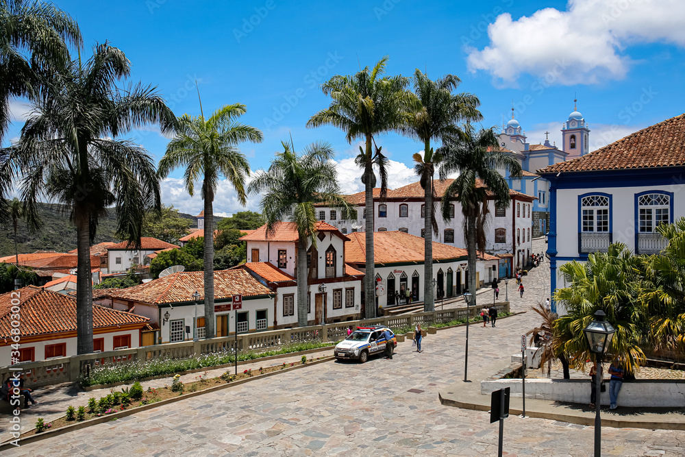 Naklejka premium View to traditional houses and palm tree lined street in historic center of Diamantina on a sunny day, Minas Gerais, Brazil