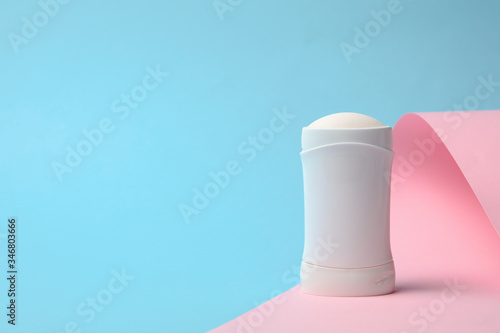 Body deodorant on two tone background, blank space for text