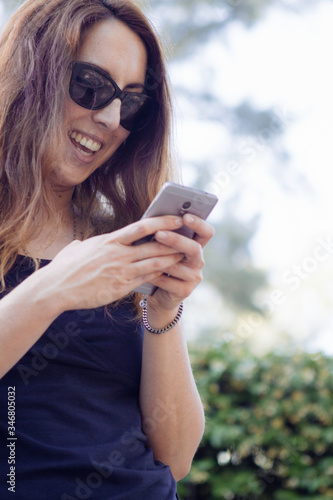 woman with a mobile. Connecting with the world