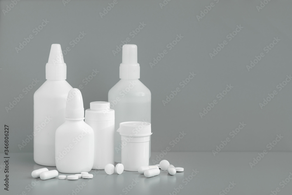 Plastic packaging medicine bottles for cosmetics vitamins pills or capsules. A container mock-up of an object to illustrate a drug pill. Plastic packaging medicine bottles for cosmetics vitamins pills or capsules. A container mock-up of an object to illustrate a drug pill.