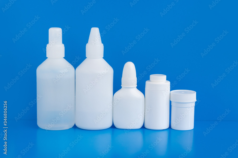 Plastic packaging medicine bottles for cosmetics vitamins pills or capsules. A container mock-up of an object to illustrate a drug pill. Plastic packaging medicine bottles for cosmetics vitamins pills or capsules. A container mock-up of an object to illustrate a drug pill.