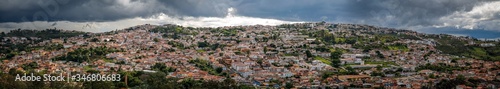 Aerial view panorama with sunshine over the historic town center and dramatic dark clouds in the sky, Diamantina, Minas Gerais, Brazil  © Uwe Bergwitz