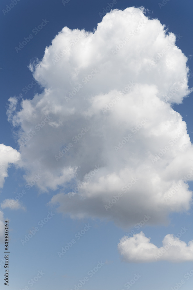 Blue background and huge clouds fluttering in the sky Blue background and huge clouds fluttering in the sky