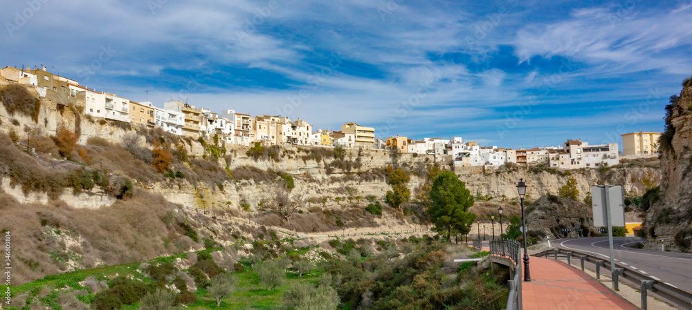 Residential buildings on the edge of high rock in Sorbas, Almeria, Andalusia.