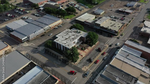 Traffic in a small town, downtown, Madisonville, Texas, USA photo