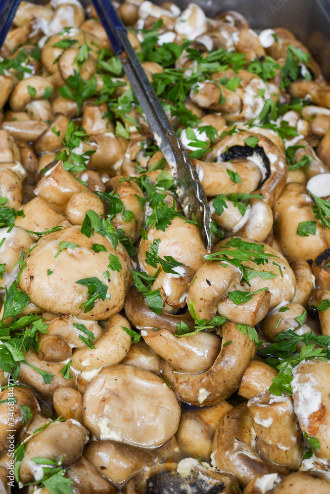 Sauteed mushrooms with garlic and parsley served during catering event. Sauteed mushrooms with garlic and parsley served during catering event.