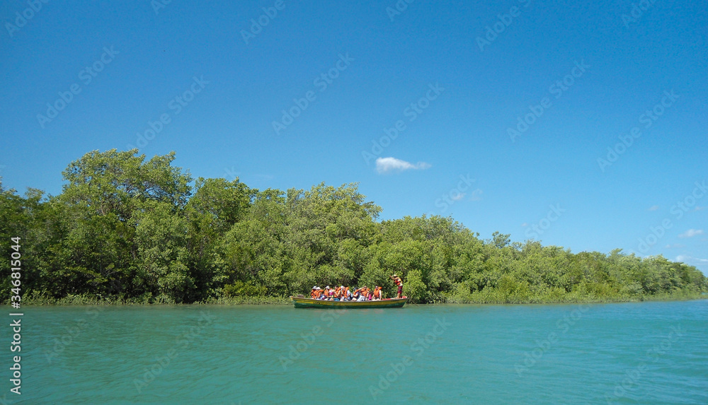 Group of tourist in a boat in Camocim, Ceara, Brazil Group of tourist in a boat in Camocim, Ceara, Brazil