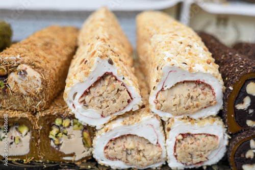 Various types or many colorful assortment of Turkish delights rolls for sale in a shop in Istanbul