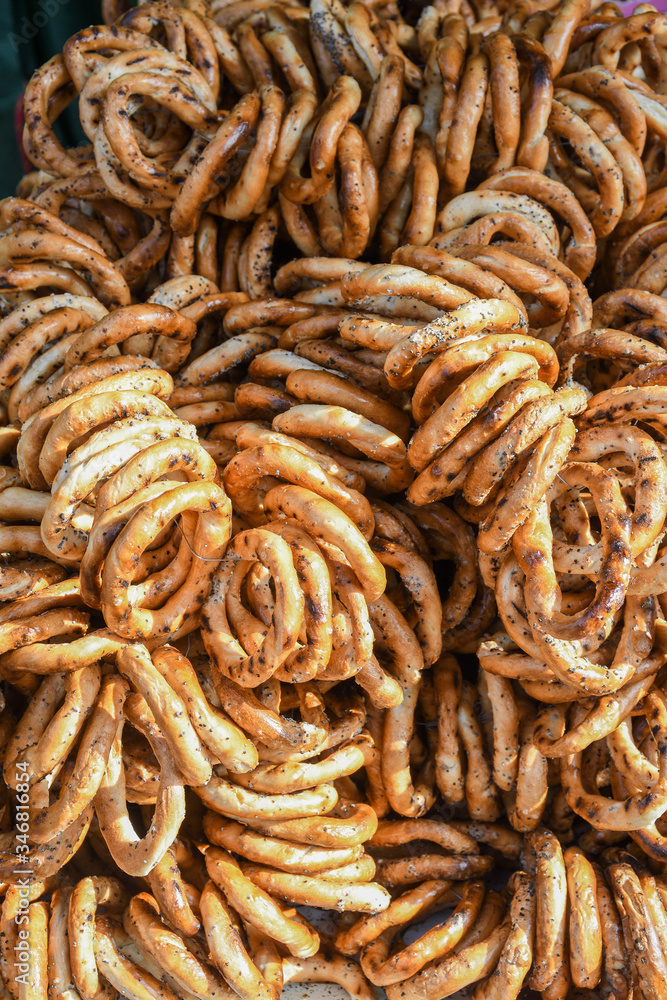 German pretzels stack one over each other, group of thin dry pretzels on rope German pretzels stack one over each other, group of thin dry pretzels on rope