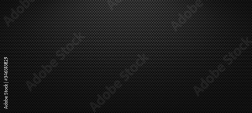 Vector carbon fiber texture. Dark background with lighting.