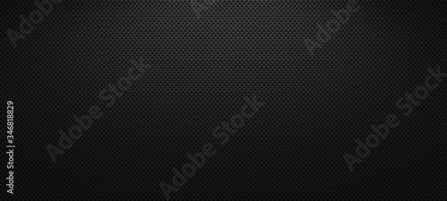 Vector carbon fiber texture. Dark background with lighting. photo