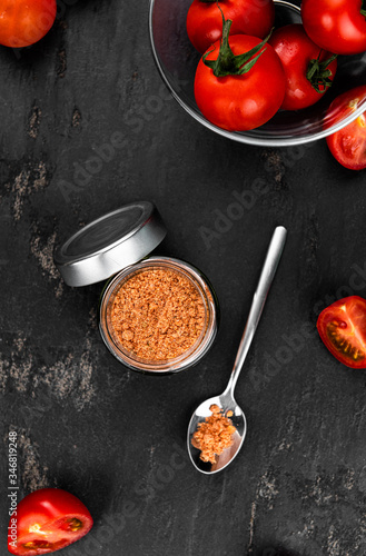 Tomato Powder (close up; selective focus) on vintage background photo