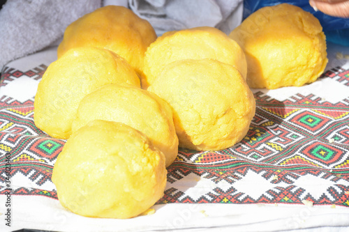 Balls of polenta and cheese in the middle of it, named bulz, a traditional romanian dish. photo