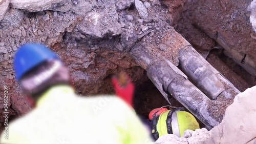 sewer  utility workers for cleaning and repairing sewerage pipes  in construction site , video,hd, footage