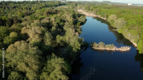 Aerial of small lake in the near of Frankfurt Germany with blue water and green trees photo