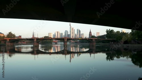 Aerial of Frankfurt Germany Reveal the skyline from under a bridge photo