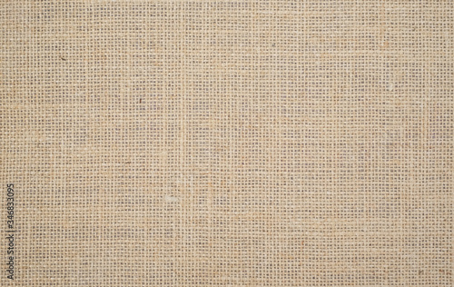 Light brown linen background Weaving Canvas Fabric Texture background. or Natural brown cloth surface .