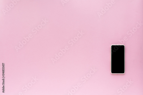 Smartphone on pink backgrou...