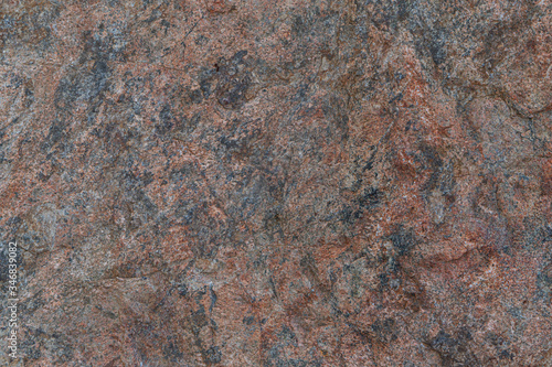 Molybdenite ore texture close-up. Contains feldspar, quartz, molybdenite, pyrite, chalcopyrite. Siberian natural resources deposit. Mineral stone surface abstract background.