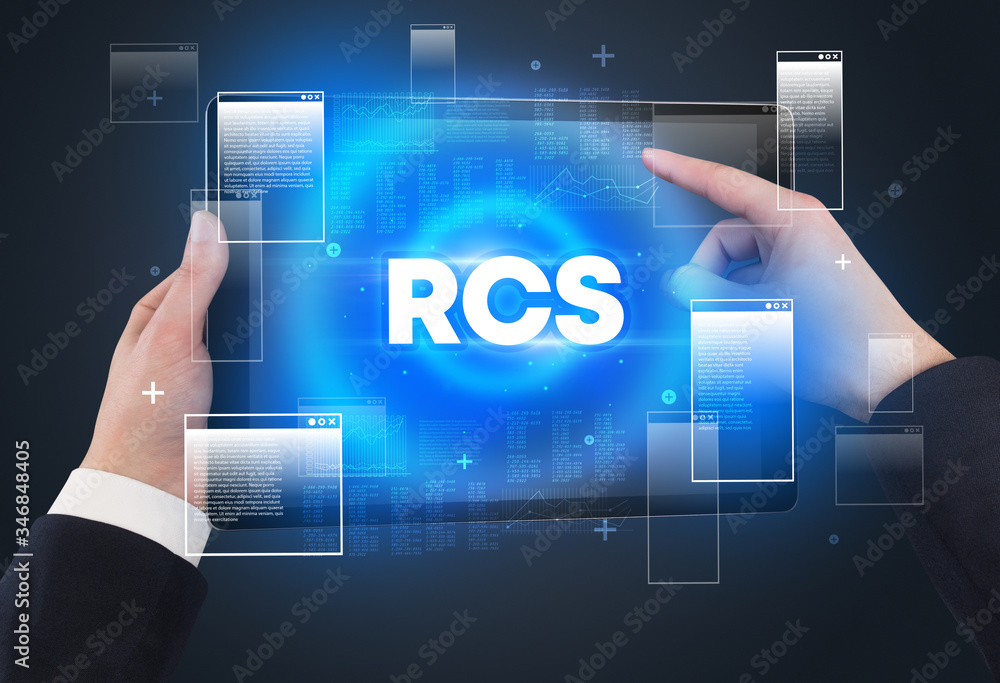 Close-up of a hand holding tablet with RCS abbreviation, modern technology concept Close-up of a hand holding tablet with RCS abbreviation, modern technology concept