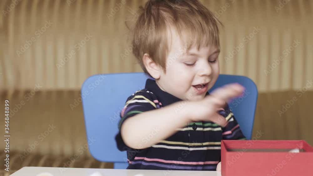 Boy child plays a puzzle Boy child plays a puzzle