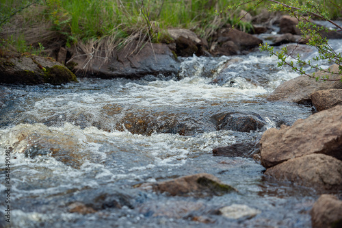 mountain river  spray water runs over stones