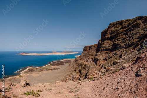 Viewpoint to La Graciosa from Lanzarote. Panorama of scenic view of La Graciosa Island and Atlantic ocean