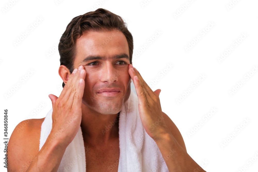 Cutout of attractive man cleansing his face with facial foam in the bathroom Cutout of attractive man cleansing his face with facial foam in the bathroom