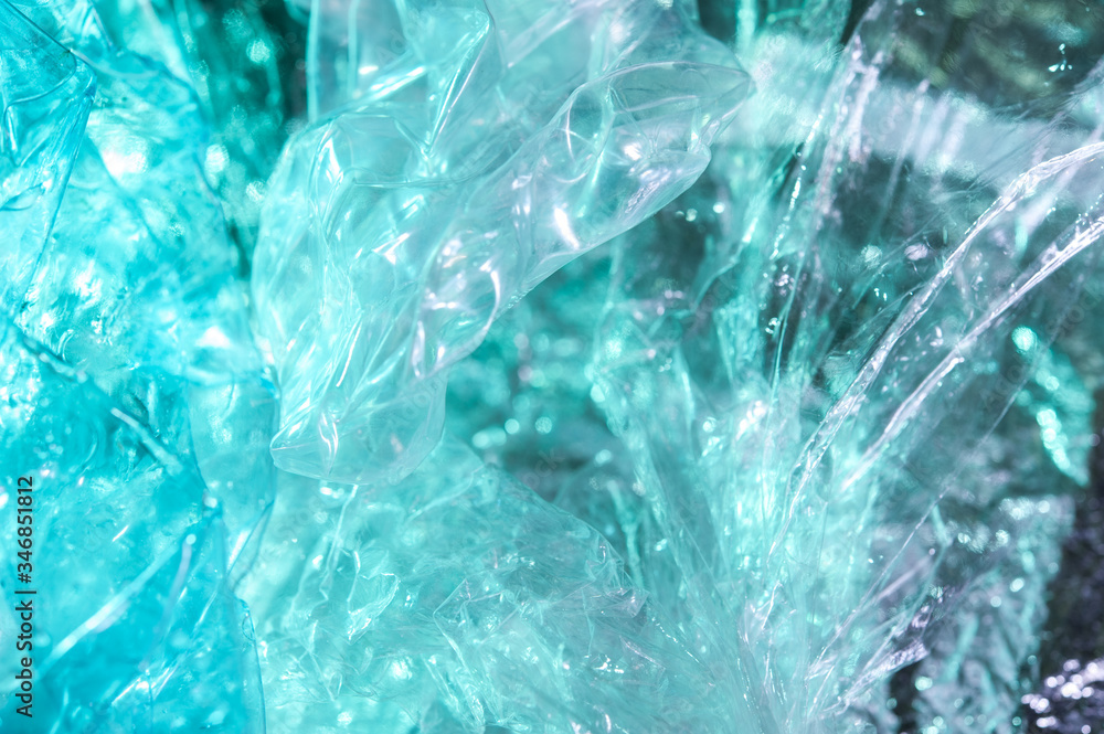 Holographic background in the style of the 80-90s. Real texture of cellophane film in bright acid colors. Holographic background in the style of the 80-90s. Real texture of cellophane film in bright acid colors.