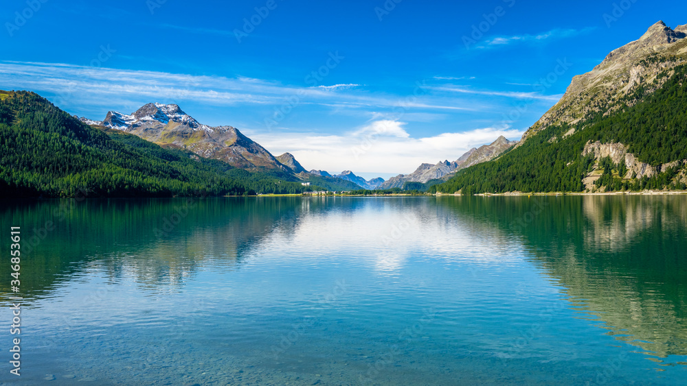 Looking at the Inn river that runs through the Upper Engadine Valley (Graubünden, Switzerland) towars Lake Sils. It lies near Sils, between Lake Silvaplana and the Maloja Pass 