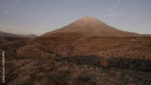 Drone shot of a Guy walking by in the Misti Volcano 