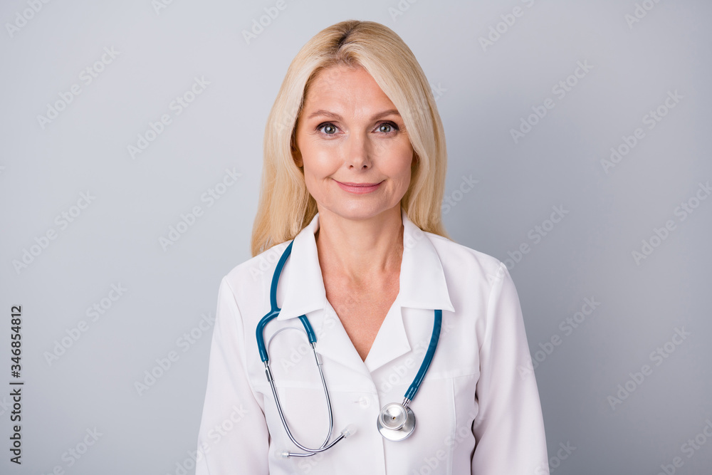 Portrait of experienced cardiologist doc old woman feel positive stop spreading corona virus infection contamination wear white coat isolated over gray color background Portrait of experienced cardiologist doc old woman feel positive stop spreading corona virus infection contamination wear white coat isolated over gray color background