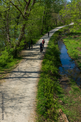 Cyclists exercise along the bike path that runs beside the C&O Canal outside of Washington DC.
