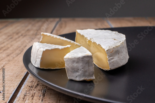 Camembert cheese - soft fatty cheese with a crust of white mold. Cow's milk cheese.