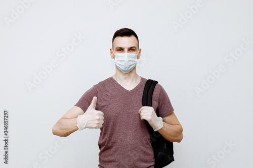 Protection from infectious diseases, coronavirus. A person wears a hygiene mask to prevent flu or cold infection. closed Studio shot on a white background 