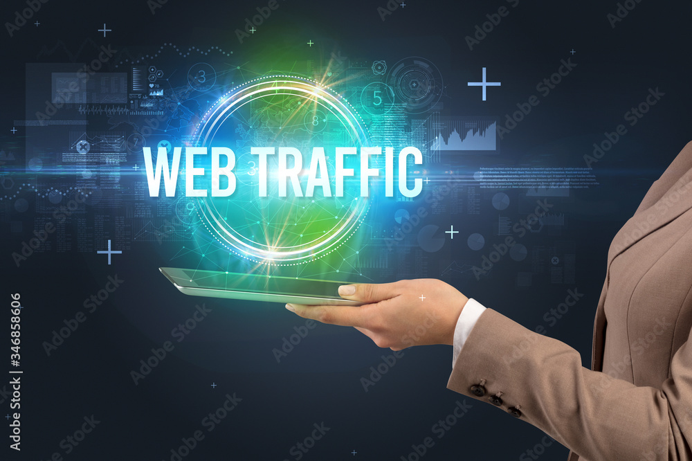 Close-up of a touchscreen with WEB TRAFFIC inscription, new technology concept Close-up of a touchscreen with WEB TRAFFIC inscription, new technology concept