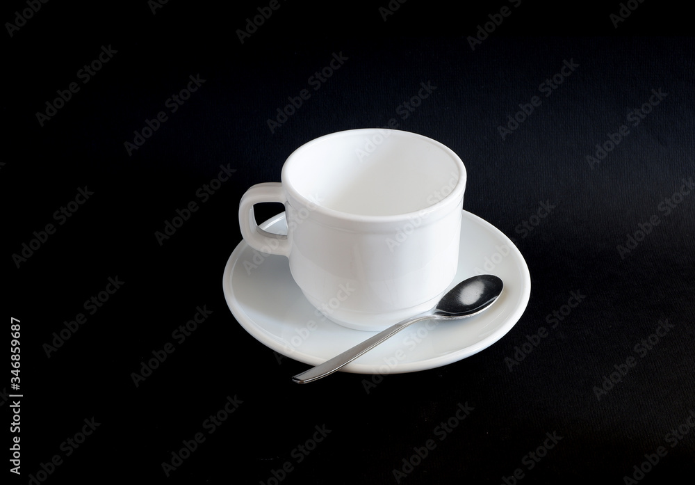 set: white mug and saucer on a black background. Suitable for mockups set: white mug and saucer on a black background. Suitable for mockups
