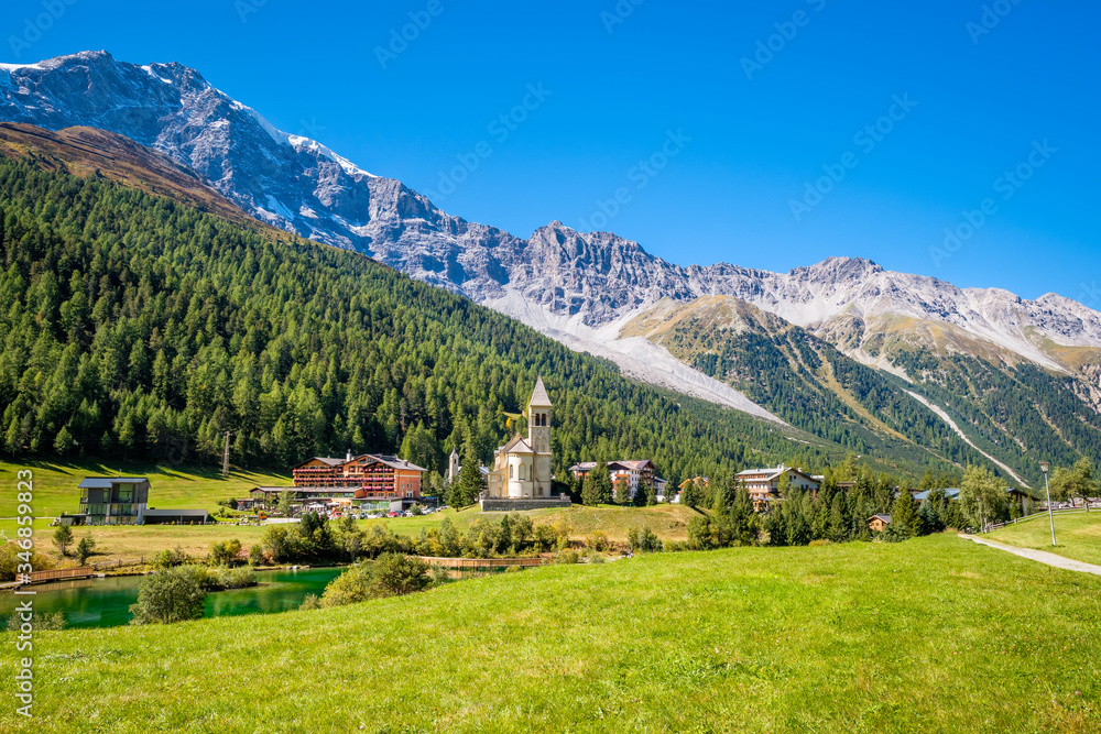 Fototapeta premium Looking at Sulden (Italian: Solda), a mountain village in South Tyrol on a sunny September day. Sulden (1,900 m) lies at the foot of the Ortler, in the Vinschgau valley east of the Stelvio Pass.