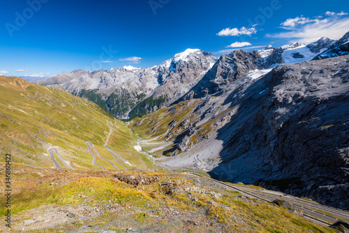 The Stelvio Pass is a mountain pass in the Ortler alps in South Tyrol (Northern Italy) and connects to the Swiss Umbrail pass towards the valley Val Müstair. It has a total of seventy-five hairpin tur