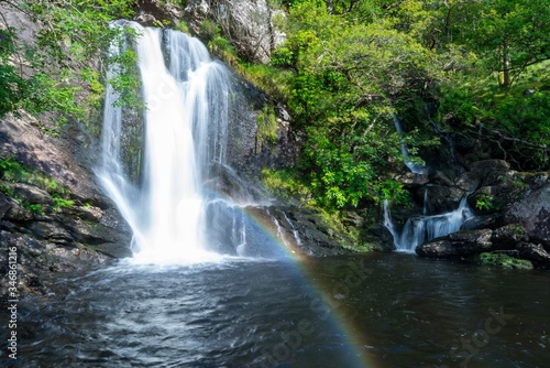 waterfall with rainbow scenic nature © Pegs