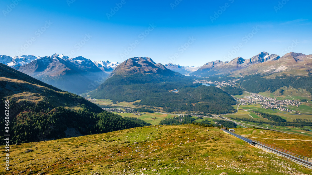 Fototapeta premium Panoramic view from Muottas Muragl (Graubünden, Switzerland) of Pontresina, Val Roseg, Celerina, the Upper Engadine Valley and the four Upper Engadine Lakes (Champfer, St. Moritz, Silvaplana, Sils)