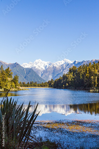 Fototapeta Naklejka Na Ścianę i Meble -  Matheson lake - Mirror Lake. Mount Cook and mount Tasman portrait. Southern Alps. South Island. New Zealand