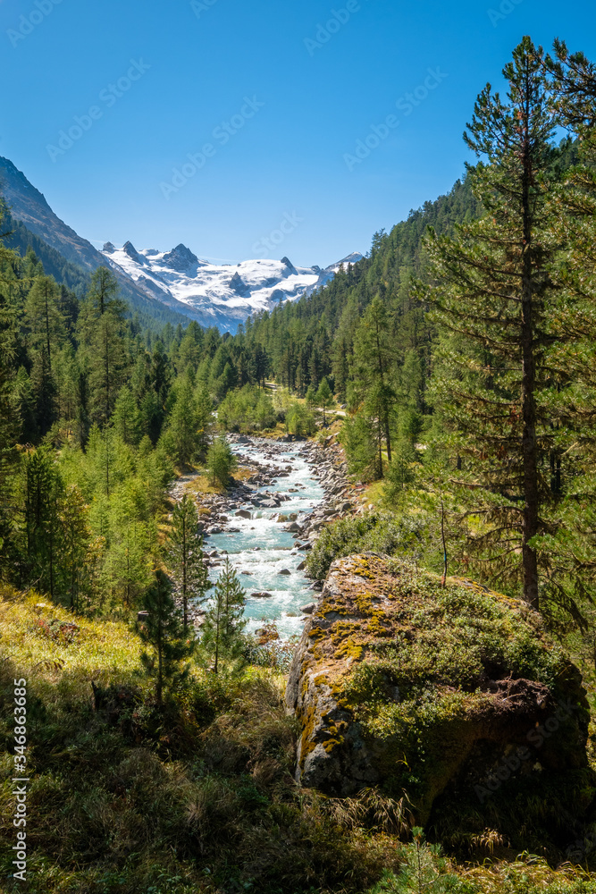 Gorgeous nature of the Roseg Valley in September. It is a valley of the Swiss Alps, located on the north side of the Bernina Range in Graubünden The valley is drained by the Ova da Roseg river. 