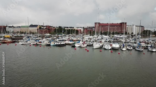 4K Helsinki Baltic Sea Finnish Bay lagoon, yachts view on cloudy summer day aerial video, Merihaka neighborhood apartment block, Tervasaari Island green park in Finland capital Suomi, northern Europe photo