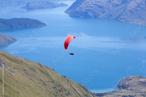 Paragliding over Roys peak, South Island, New Zealand