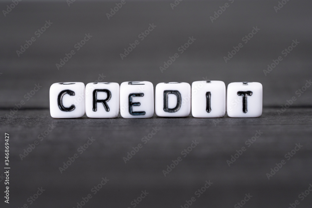 CREDIT word composed of white cubes on black background CREDIT word composed of white cubes on black background