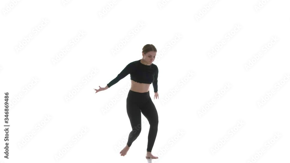young beautiful girl dancer in black short top and black leggings dancing contemporary, modern ballet dance, isolated, slow motion young beautiful girl dancer in black short top and black leggings dancing contemporary, modern ballet dance, isolated, slow motion