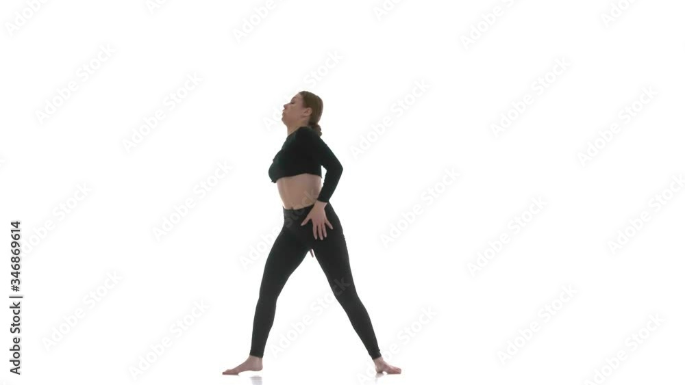 young beautiful girl dancer in black short top and black leggings dancing contemporary, modern ballet dance, isolated, slow motion young beautiful girl dancer in black short top and black leggings dancing contemporary, modern ballet dance, isolated, slow motion