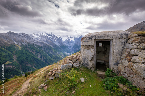 In the valley Val venosta (German: Vinschgau) in the region Alto Adige (German: Südtirol) among gorgeous mountain like the Ortler Group there are bunkers to be found dating back to World War II photo